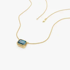 14K Gold 1.25 ctw Emerald Cut Bezel Setting Blue Topaz