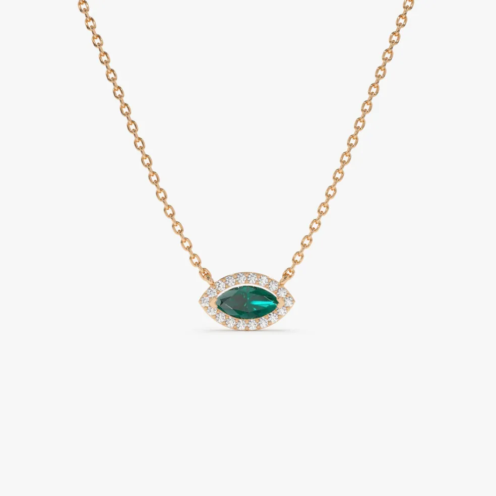 14k Marquise Emerald with Halo Diamond Setting