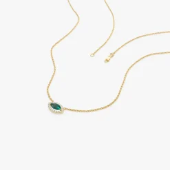 14k Marquise Emerald with Halo Diamond Setting