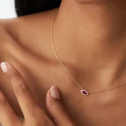 14k Marquise Ruby with Halo Diamond Setting