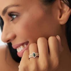 14k Marquise Shaped Emerald Ring with Nesting Diamond Bands