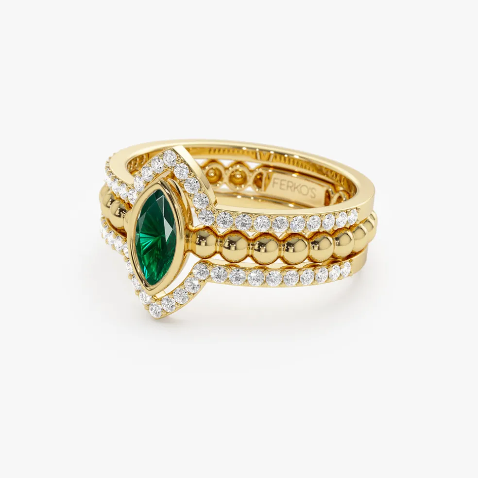 14k Marquise Shaped Emerald Ring with Nesting Diamond Bands